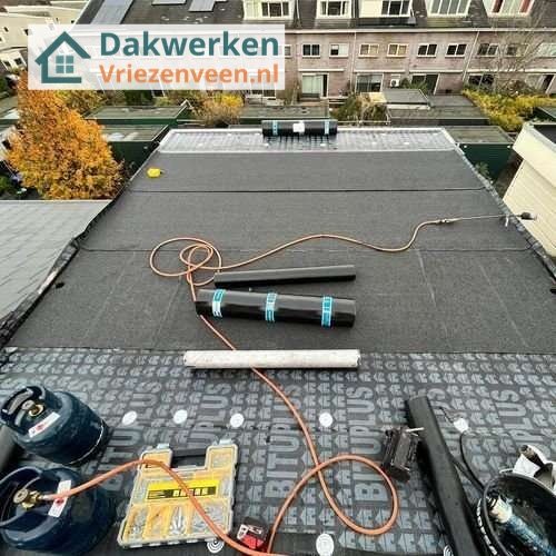Plat dak Vriezenveen opnieuw leggen